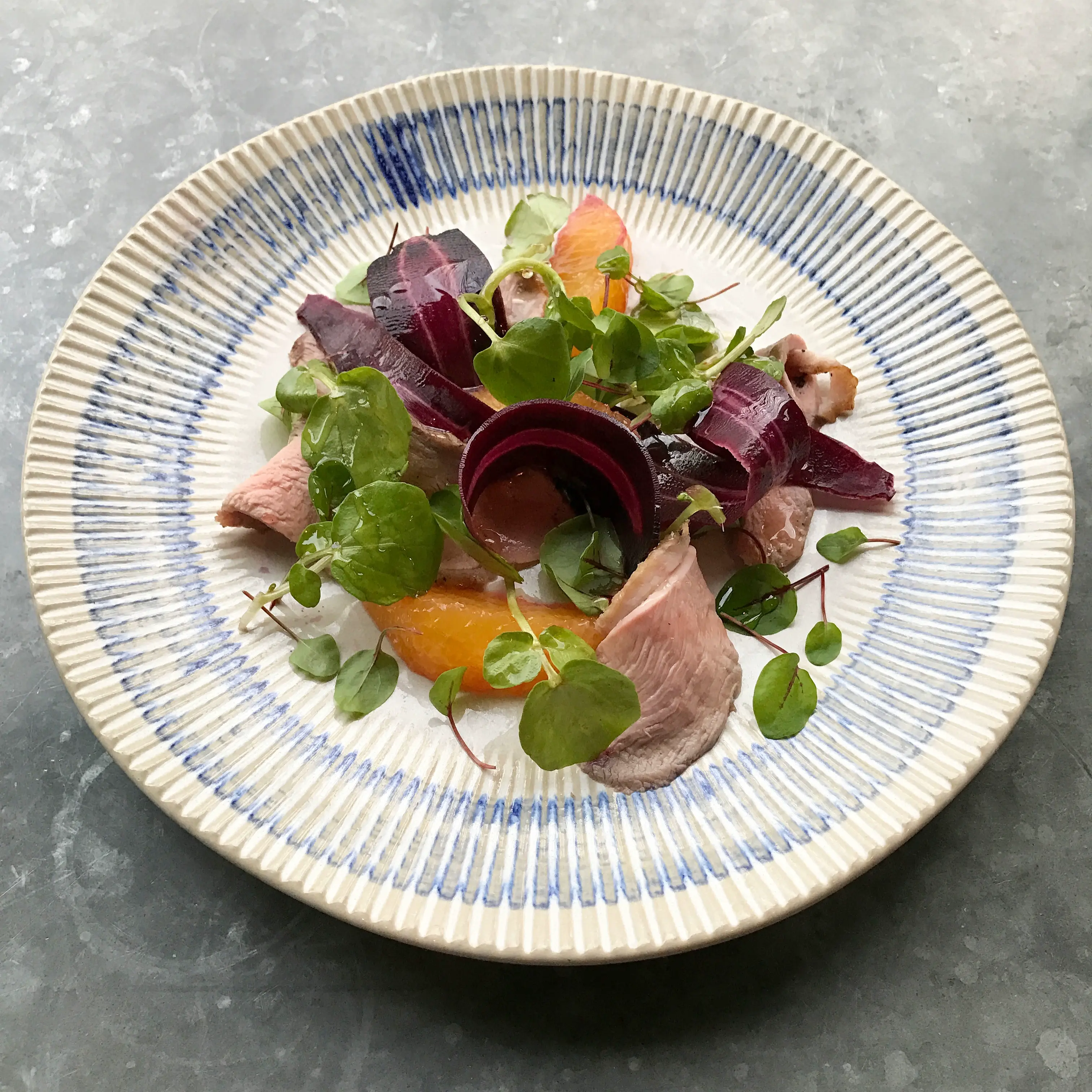 Chef preparing dishes with attention to detail